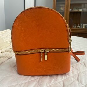 Orange leather mini backpack from Italy; never worn. 🍊